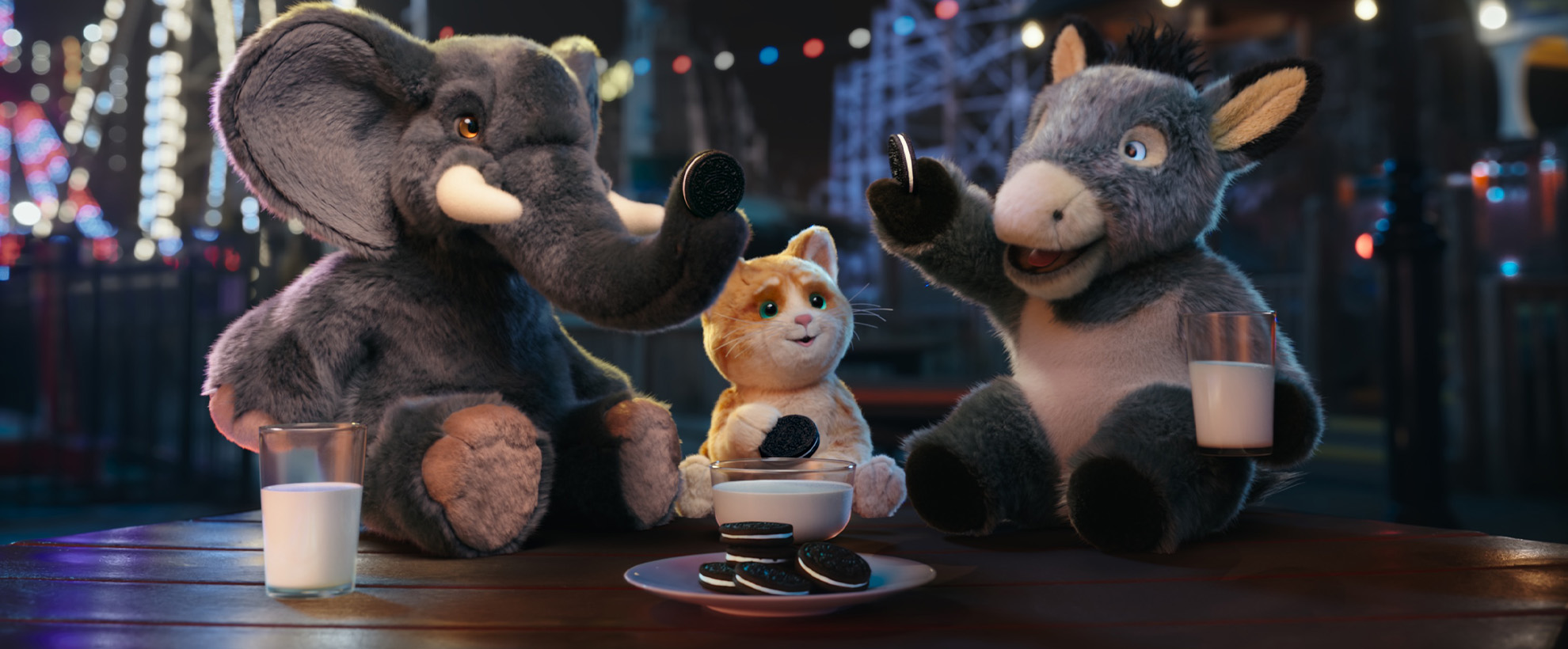 Three stuffed toy animals, an elephant, a cat, and a donkey are cheering with Oreos over glasses of milk.