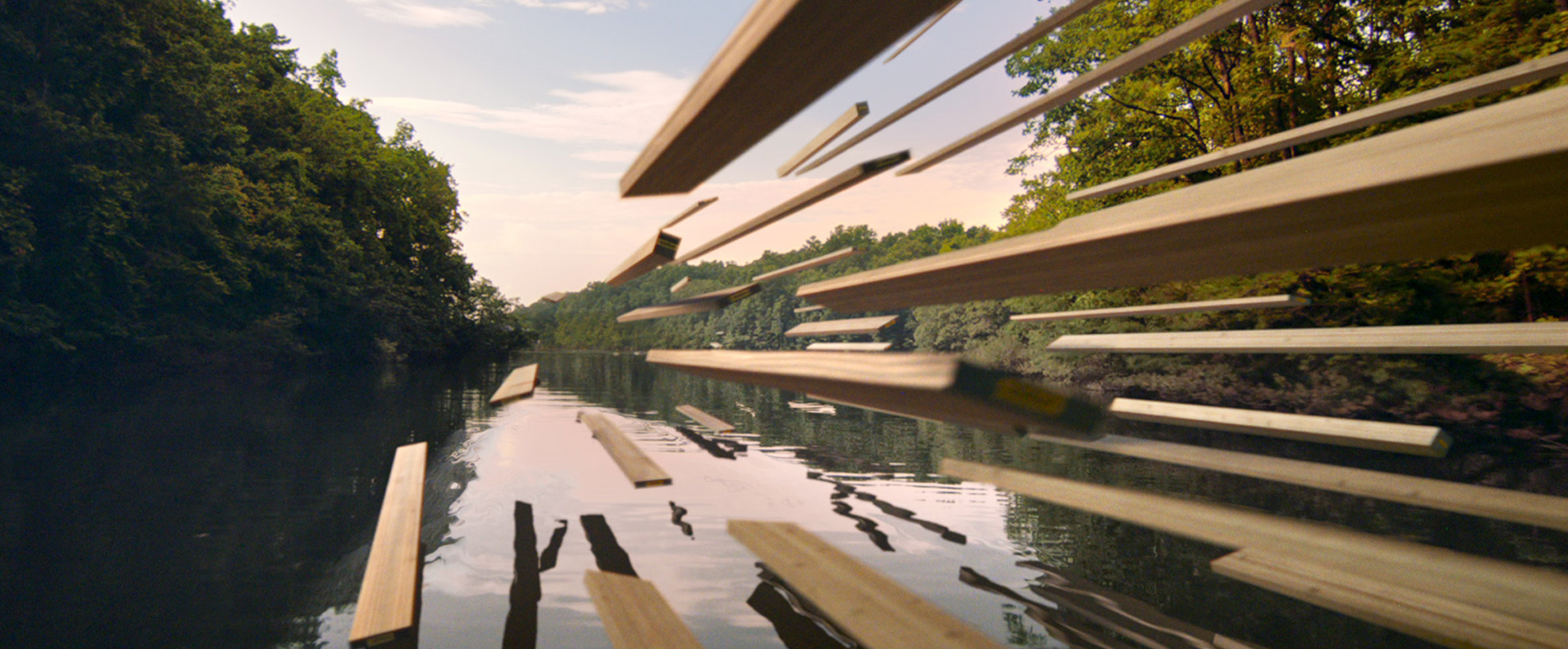 Wood boards soar over a calm lake surrounded by trees