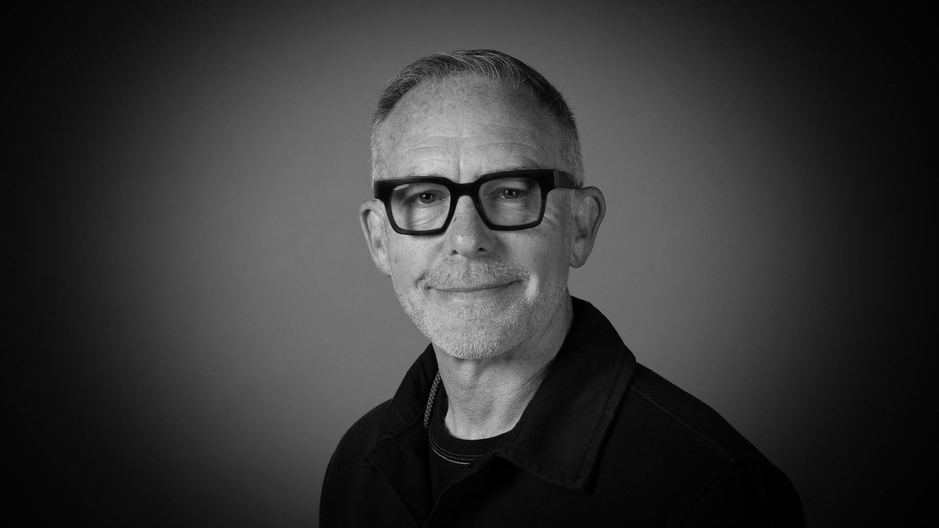 A black and white photograph of Chief Creative Officer Mike McGee