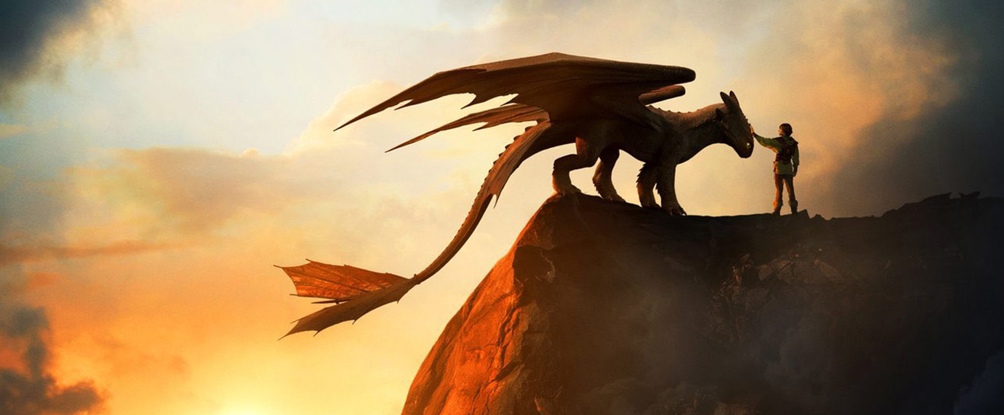 Hiccup and Toothless stand on a cliff edge against a sunset