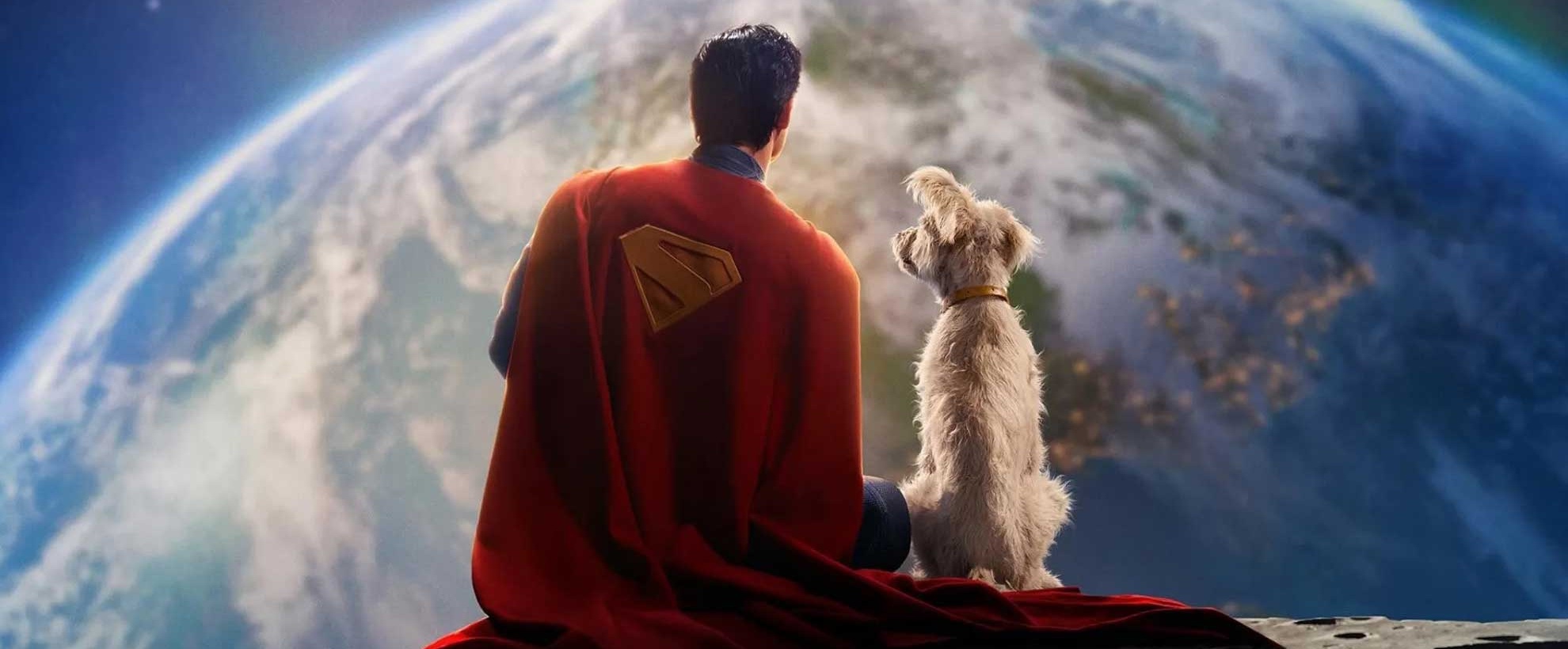 Superman sits on a planet, looking at Earth, with his white dog Krypto. The image is a teaser shared by director James Gunn.