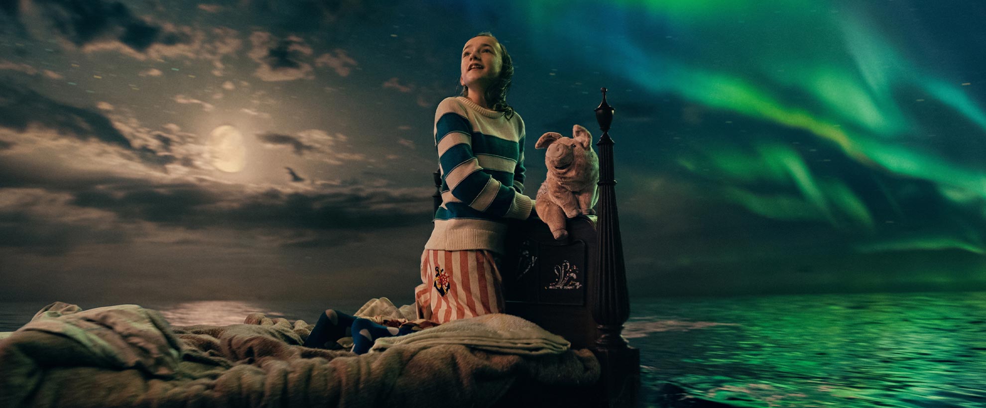 Nemo sits on her bed, with animated cuddly toy Pig, as it floats across a CGI ocean