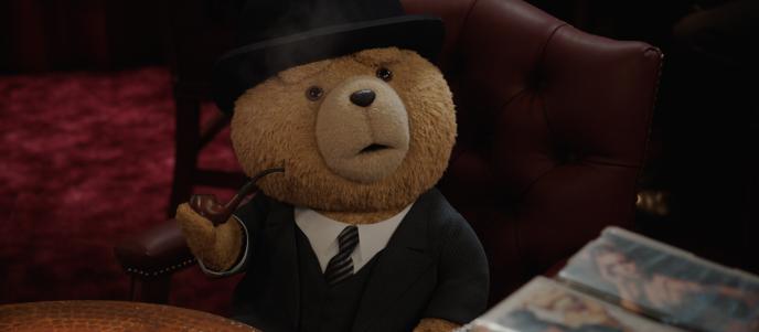 Ted sits in a leather chair, wearing a full suit and bowler hat, holding an old fashioned smoking pipe