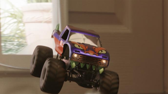 front view of a toy monster truck suspended in air