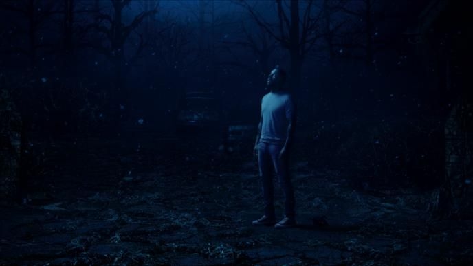 actor idris elba looking up while standing in the upside down from stranger things