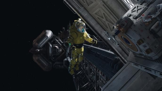 an astronaut in a yellow spacesuit floating in space next to a spacecraft