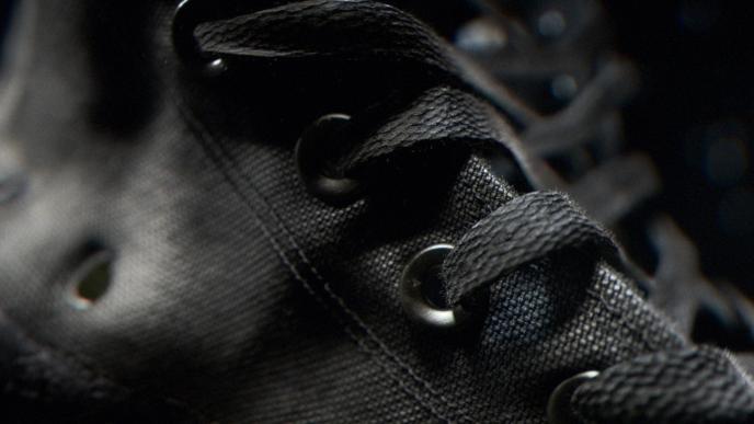 close up the details of a converse shoe eyelets and laces