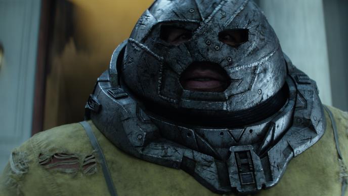 close up face view of juggernaut character wearing an iron clad helmet
