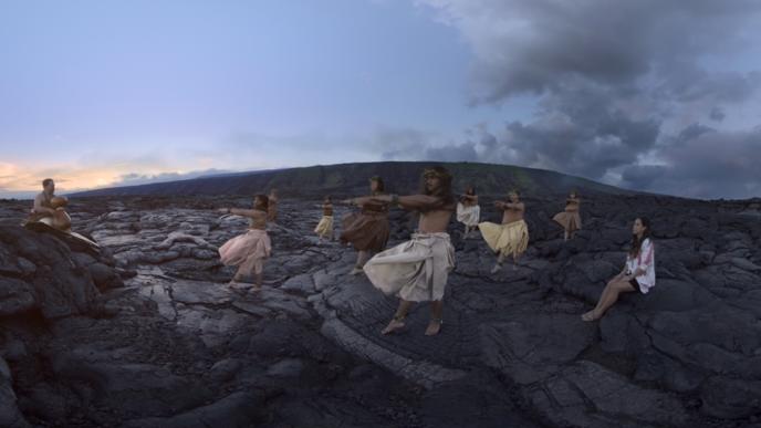 hula dancers dancing amongst a volcanic mountain