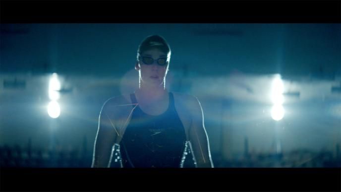 a front view of a professional swimmer in speedo swimming gear