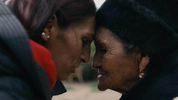 A mother and daughter embrace in a heartfelt moment 