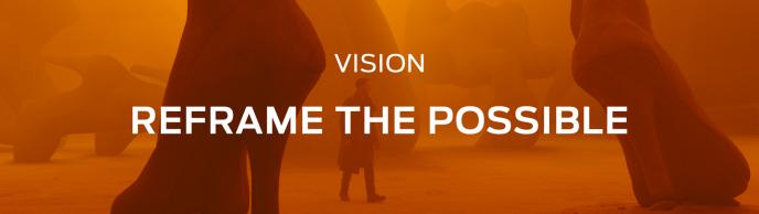 'VISION. reframe the possible' text overlayed over an orange hazed film shot