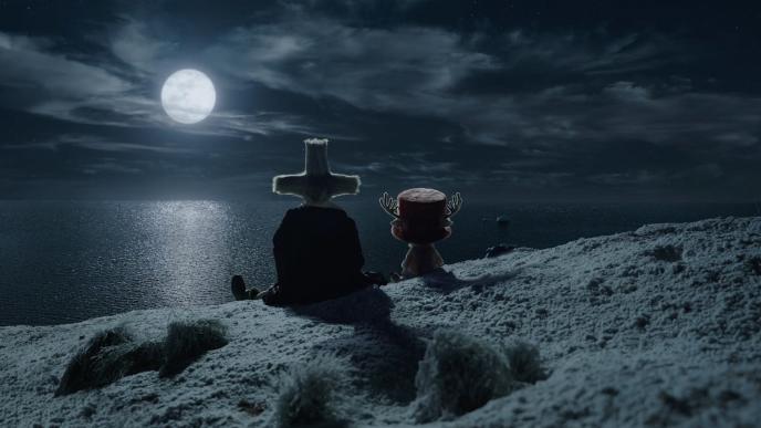 Dr. Hiriluk and CG animated Tony Tony Chopper from One Piece sit on a cliff overlooking the ocean, a full moon lights up the sky
