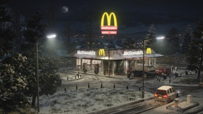an animated mcdonald's building. it is snowing and there are christmas decorations around the building
