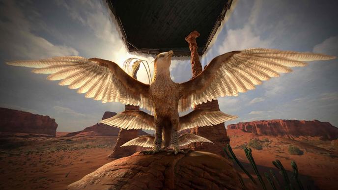 thunderbird creature from fantastic beasts and where to find them standing proud with its six wings spread open in front of a canyon that has been propped up by sheets in a studio