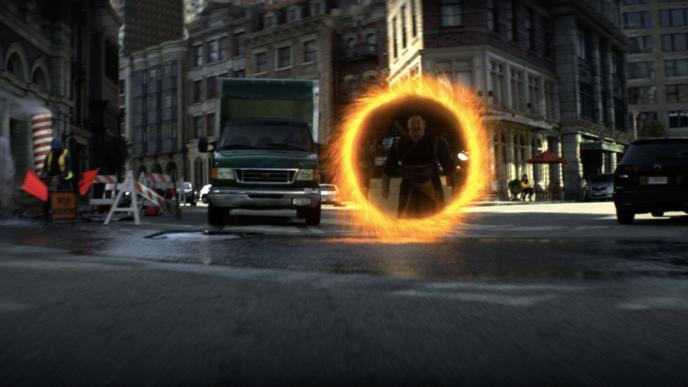 sorcerer supreme wong showing up through an inter-dimensional portal in the middle of a street in london
