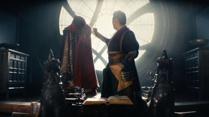 sorcerer supreme wong looking back to doctor strange's animated cloak