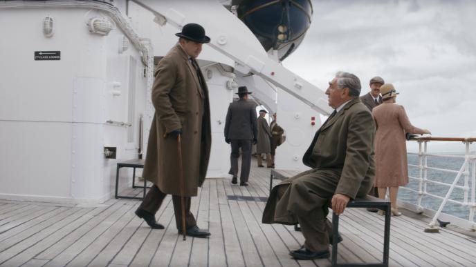 Hugh Bonneville and James Carter on a boat