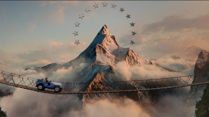 A mountain surrounded by stars, a jeep crosses a bridge in front