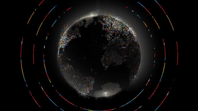 graphic image of earth in a black background made of of small colourful bubbles inside of colouful circular lines