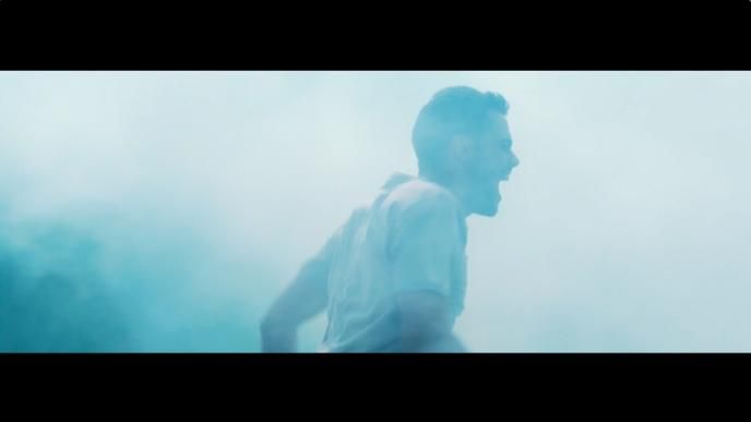 an actor screaming while surrounded in mist