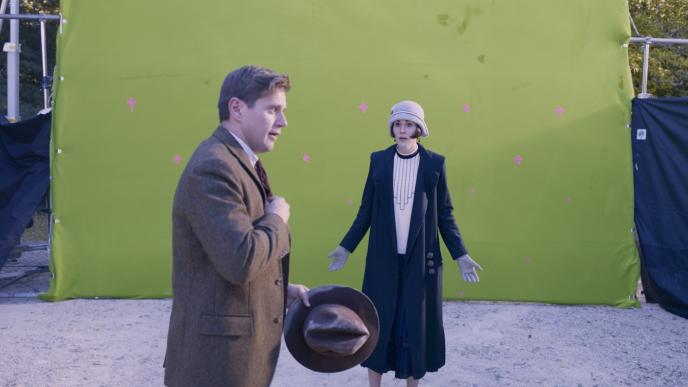 actors standing in front of a green screen