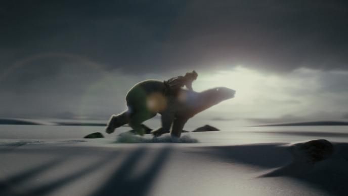 actress dakota blue richards as lyra belacqua riding polar bear iorek byrnison across snowy terrain