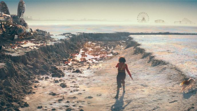 person running through a desert surrounded by broken and abandoned amusement rides and attractions