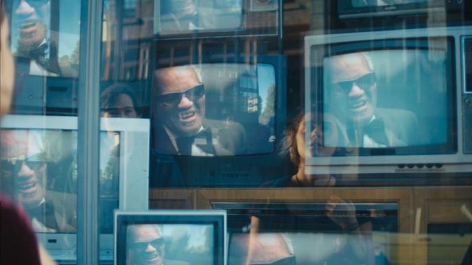 a person looking into a retro television display