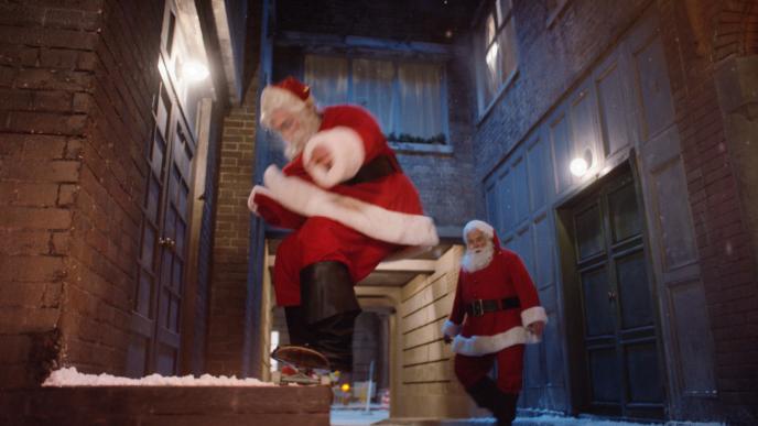 Santa on a skateboard in the snow