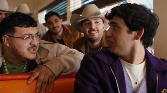 Marcello Hernández and Grupo Frontera in a diner booth