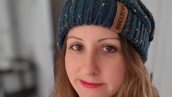 A close up shot of Sabrina Gagnon a Supervising Executive Producer wearing a beanie.  
