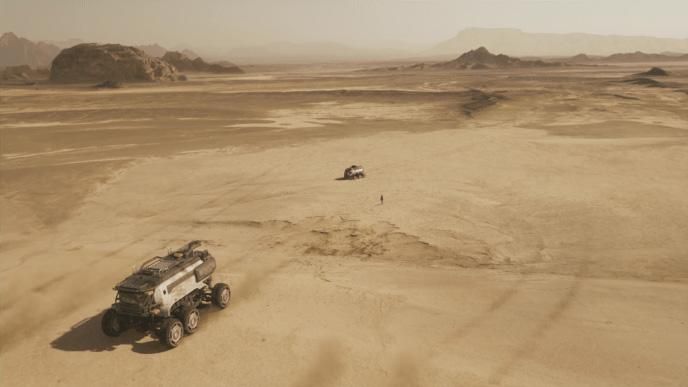 an astronaut standing between two spacecraft rovers on red planet mars