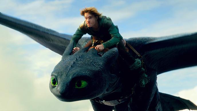 Hiccup from How to Train Your Dragon riding a photoreal animated dragon through the sky.