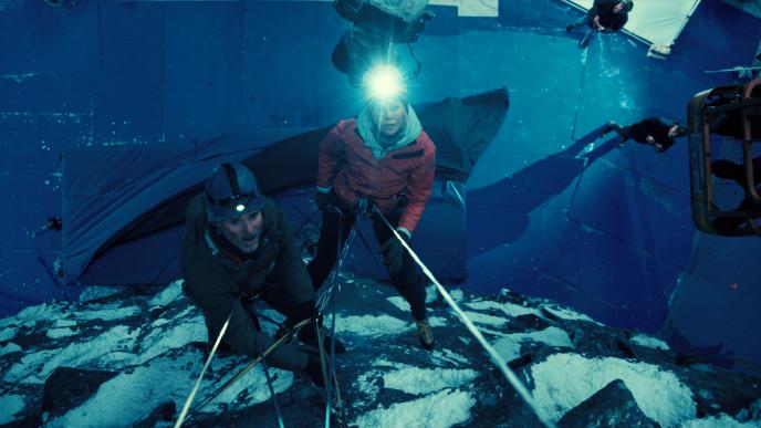 Charlize Theron and Eric Bana on set of Apex, climbing the Troll Wall set