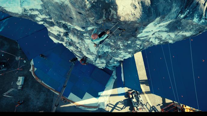 Plate photography of Charlize Theron and Eric Bana climbing the Troll Wall on set of Apex