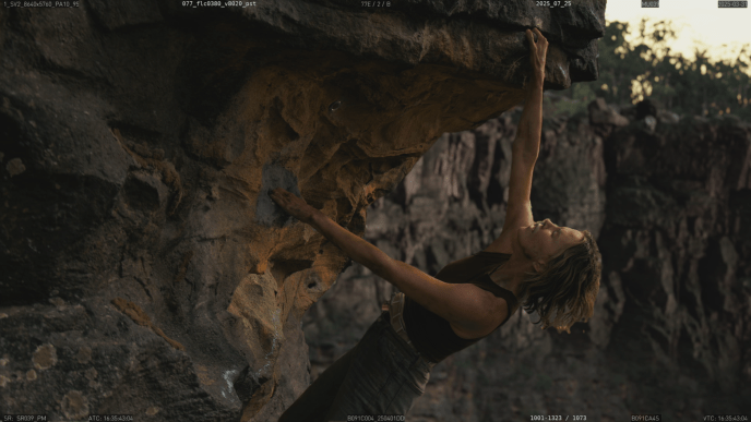 Charlize Theron climbing the Australian gorge set, with postvis environment work by Framestore Pre-production Services