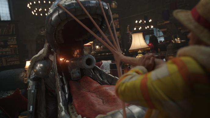 Luffy uses his stretch ability to pull Wapol's a giant metal mouth with a cannon-like opening inside a grand hall.