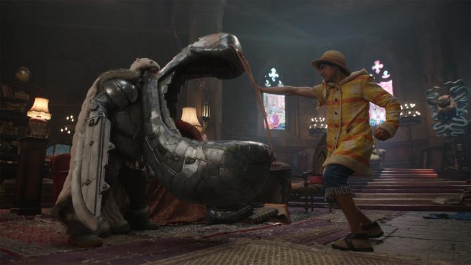 Luffy confronts a towering & armored Tin-Plate Wapol who has a giant metal mouth like weapon.