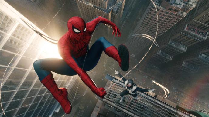 Spider-Man swings from building to building using webs