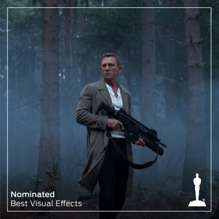 james bond holding an assult rifle in a forest