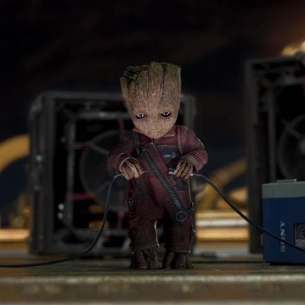 baby groot plugging in a miniature sound system