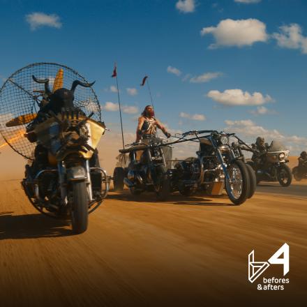 A group of bikers travelling through a sunny desert scene.