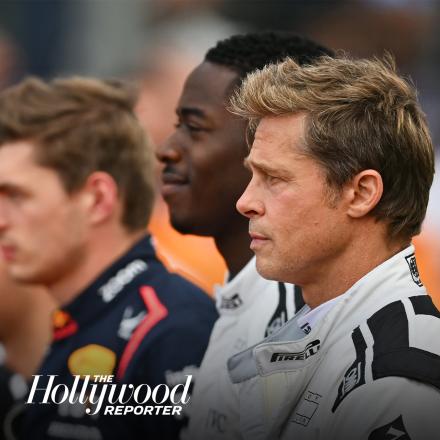 Three men standing facing to the left wearing F1 racing uniforms, there is the Hollywood Reporter logo in the left hand corner.