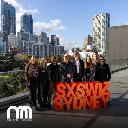 group stood behind red SXSW Sydney sign 