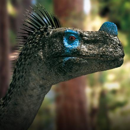 A CG dinosaur with blue and green scales facing to the right. 