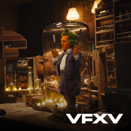 A still from Wonka showing a digital human under a glass with the VFX Voice logo in the bottom left. 