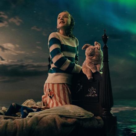 Nemo sits on her bed, with animated cuddly toy Pig, as it floats across a CGI ocean