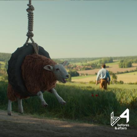 A still from The Sheep Detectives showing a photo-real CGI sheep stuck in a tire swing.