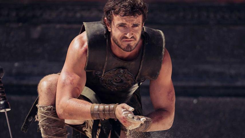 Paul Mescal in Gladiator 2, kneeling in a coliseum. 